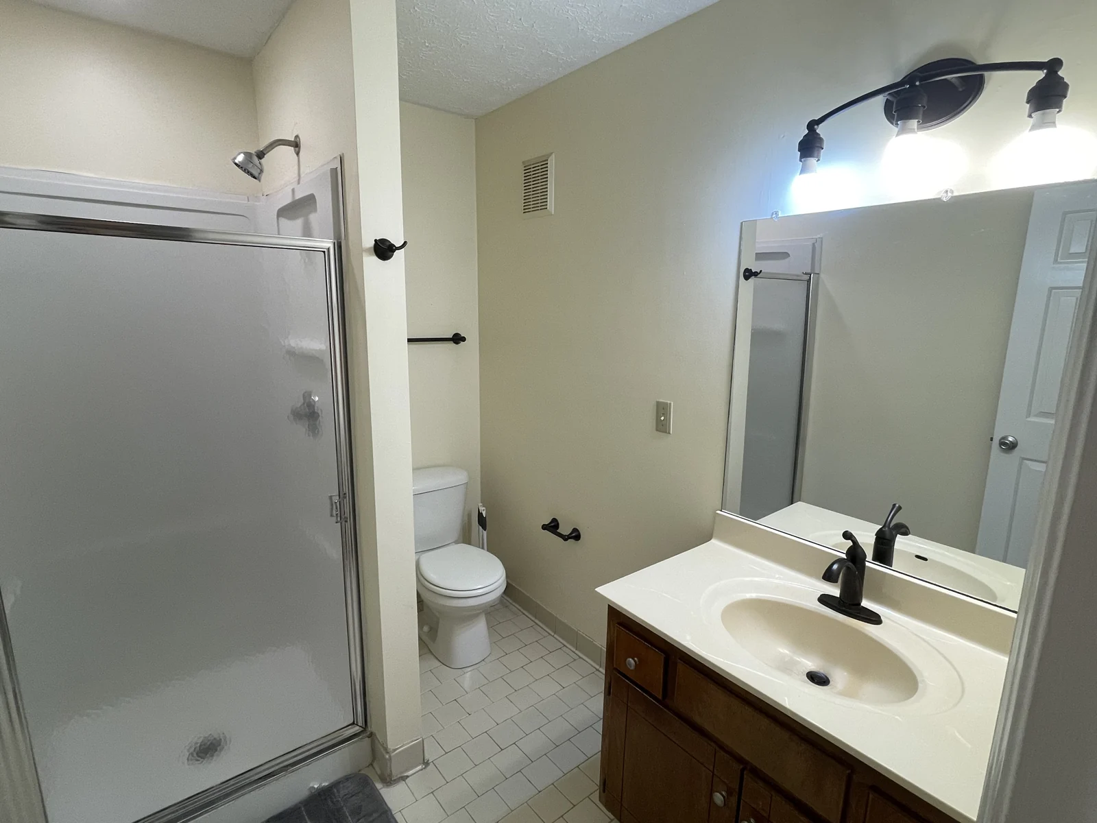 Bathroom with walk-in shower in the furnished Midtown Nashville condo