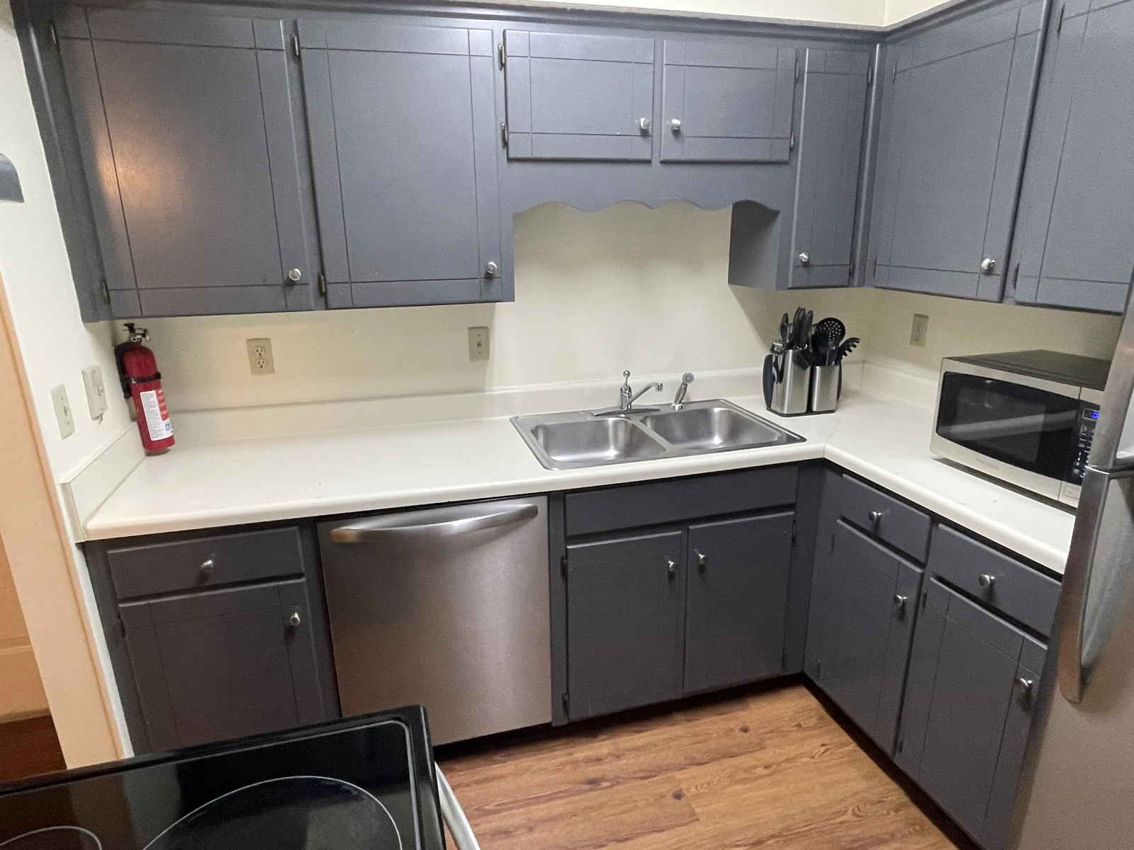 Kitchen with everyday essentials in the furnished Midtown Nashville condo