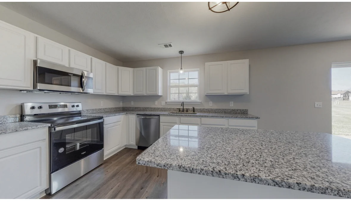 A bright kitchen with an island in the Mount Juliet home